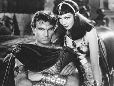 Claudette Colbert and (Henry Wilcoxon in Cecil B. DeMille's 1934 film Cleopatra.